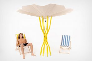 这个沙滩伞展开了一种光伏阵列，使用太阳能来酷！